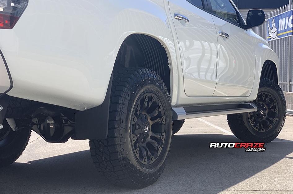 MITSUBISHI TRITON VAPOR BLACK MACHINED WITH DARK TINT